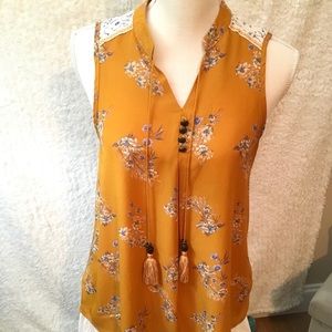Gold floral sleeveless summer blouse w/tassels.
